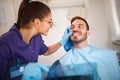 Dentist looking patientÃ¢â¬â¢s teeth